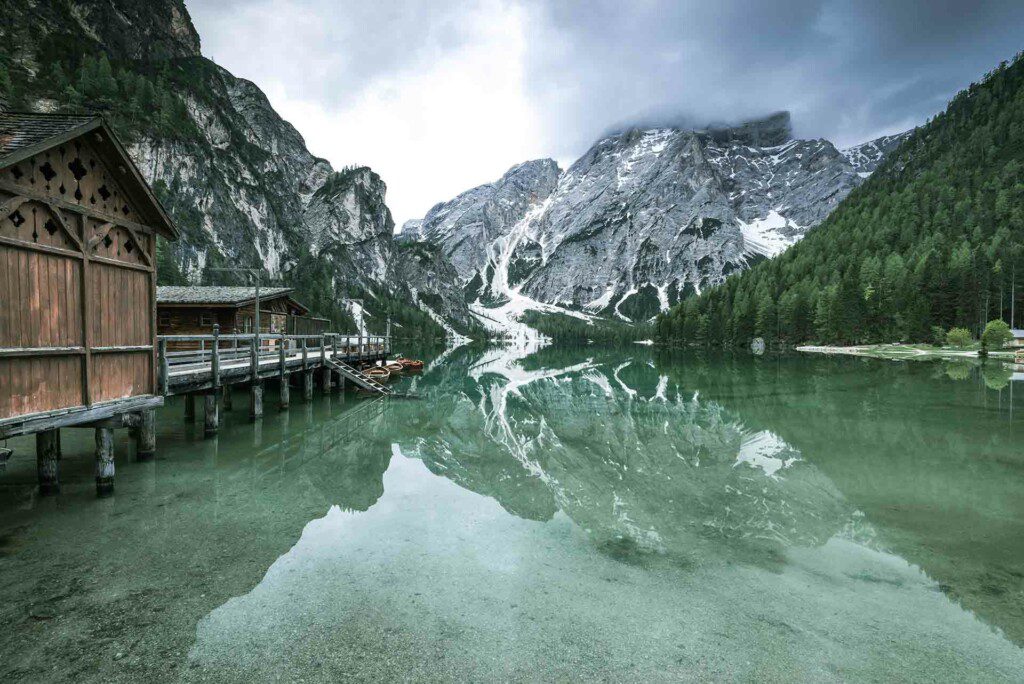 Moody image of Pragser Wildsee or Braies Lake in Italy.